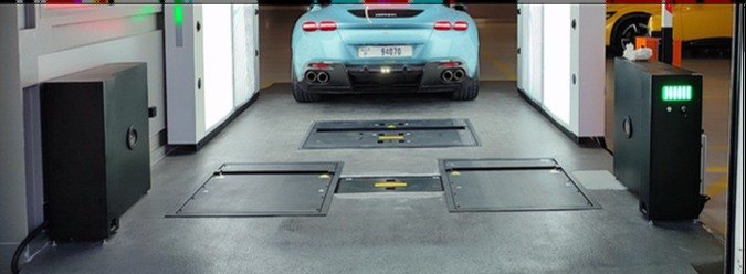 Tire scanner measuring tread depth as a car drives over